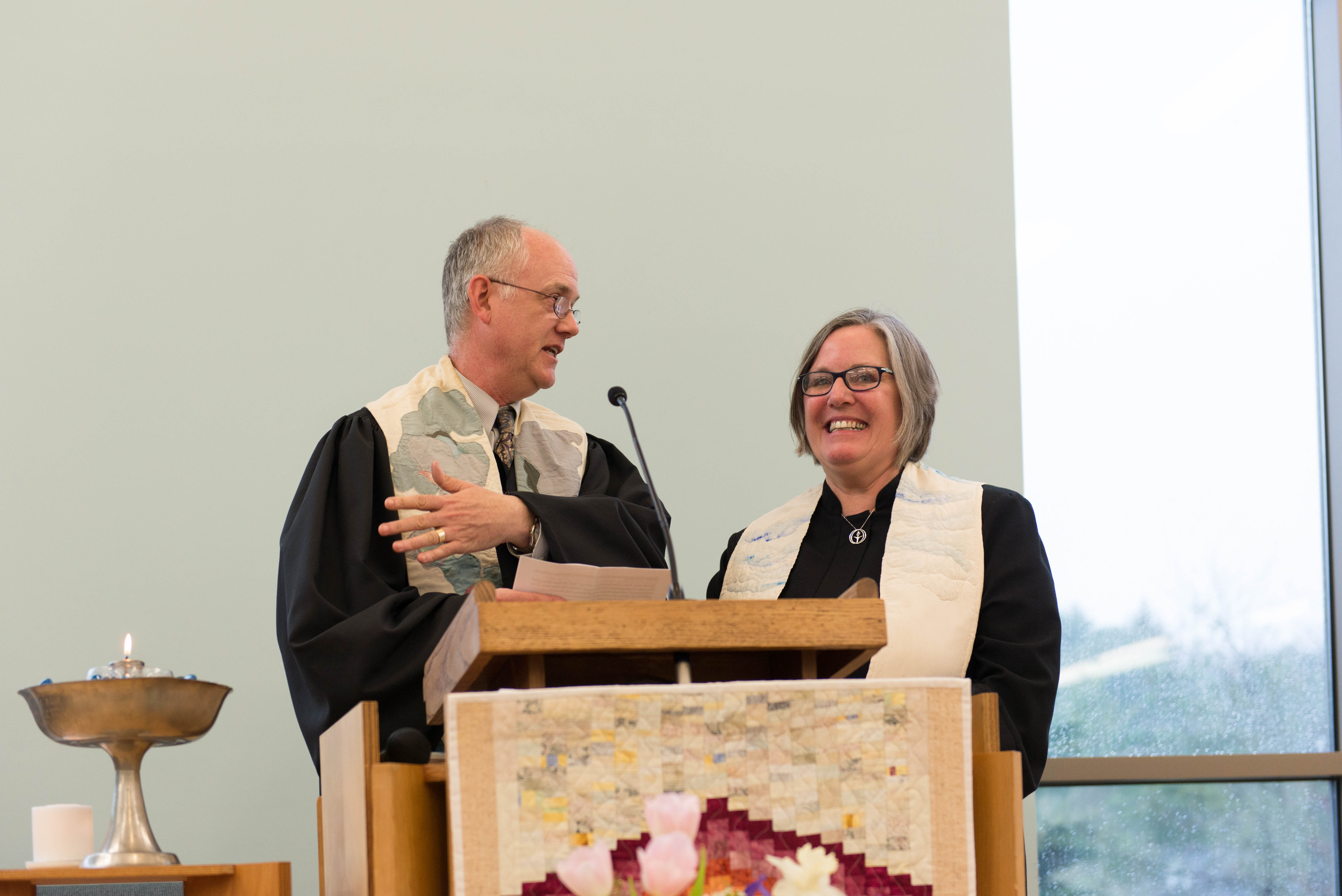 Rev. Paul Boothby giving charge to Minister