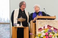 Rev. Jeanne Pupke giving charge to congregation